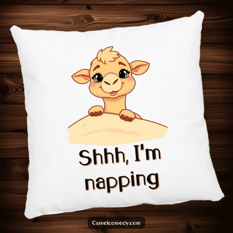 Funny pillow featuring a camel with a goofy grin peeking from behind a sand dune, perfect for adding whimsical comfort.