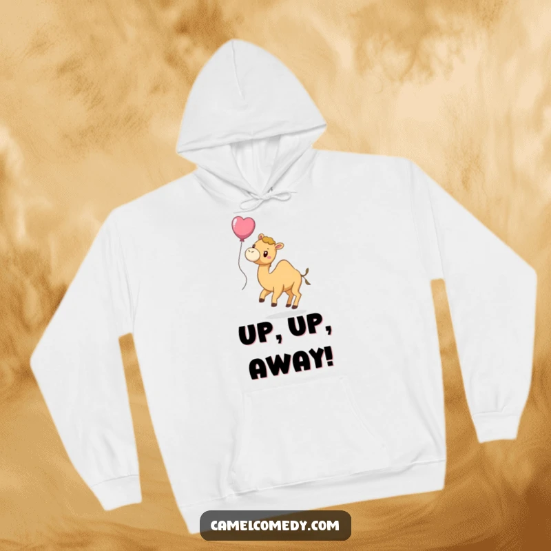 Funny hoodie displaying a playful camel with a balloon tied to its tail, floating serenely with a joyful demeanor.