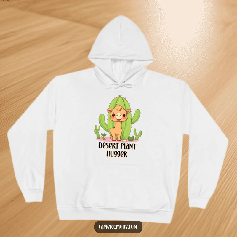 Funny camel cactus hoodie showing a curious camel peeking around a smiling cactus, offering warmth and humorous desert vibes.