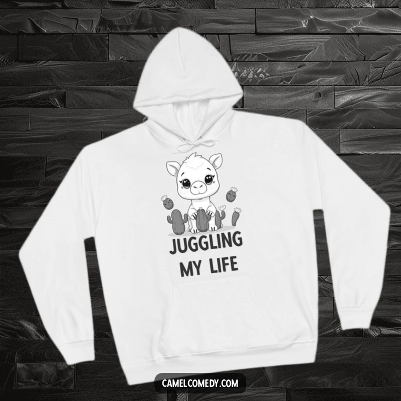 Funny hoodie showcasing a kawaii camel juggling cacti with wide eyes, offering warmth and desert-themed humor.
