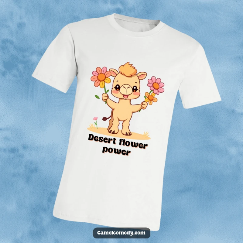 Funny t-shirt depicting a comical camel artistically juggling three colorful desert blooms with a determined yet silly grin.