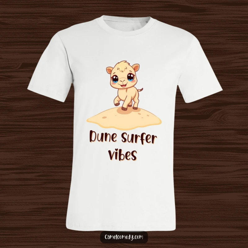 Funny camel t-shirt featuring a tiny camel with large eyes, bouncing energetically on a sand dune, radiating infectious happiness.
