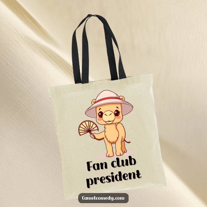 Funny kawaii camel with a bucket hat and fan, looking warm but trying to stay cool, on a tote bag.